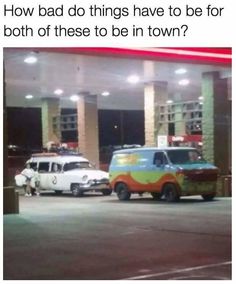 two cars parked in front of a gas station