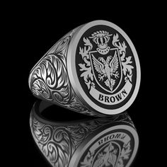 Rectangular Engraving Design Engraved Family Ring, Coat of Arms Ring, Handmade Custom Family Crest Ring, Personalized Family Crest Ring, Custom Signet Ring Product Details: ✅ Material: 925 Sterling Silver, Gold Coating, Black Rhodium Coating ✅Ring Size: Available in various sizes (please refer to our sizing chart) ✅Handmade with exceptional craftsmanship ✋🎨 ✅ Dimensions: 15x20mm /14 ± gr 🛡️ Discover our custom coat of arms jewelry, a symbol of heritage made uniquely yours! 🌟💍 Choose your family crest and let us bring it to life with expert craftsmanship. 🖌️✨ Our artisans create stunning pieces in silver, gold coating, or rhodium coating, tailored to your preferences. 💫🔒 With attention to detail and a touch of elegance, our jewelry collection includes signet rings, pendants, and brac Arms Jewelry, Family Crest Ring, Family Crest Rings, Custom Signet Ring, Family Ring, Family Rings, Arm Jewelry, Men Jewelry, Black Rhodium