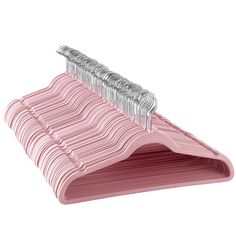 three pink hangers are stacked on top of each other with silver pins sticking out of them