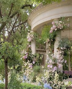 an outdoor garden with flowers and greenery