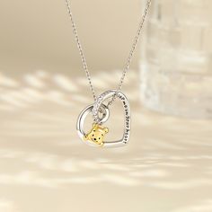 Friendly, thoughtful and always ready to help his friends, this cute bear is filled with love. You can engrave with your own message. This pendant is sure to make a personalised treasure and unforgettable romantic jewellery gift.Carat Weight: 0.6 ctStone Size: 1.5 mmStone Type: Jeulia® StoneNumber of Stones: 8 Stone Color: Diamond WhiteStone Shape: RoundWeight: 3.6 gWidth: 19.8 mmHeight: 20.9 mmThickness: 8.2 mmMaterial: 925 SilverPlating Color: Silver, Yellow GoldLength: 400+50 mmChain Color: S Heart Cut Engraved Necklace For Valentine's Day, Valentine's Day Engraved Sterling Silver Heart Necklace, Valentine's Day Heart-shaped Brown Necklace, Bear Design Pendant Jewelry As Gift, Heart-shaped Necklace For Valentine's Day Commemoration, Bear Design Pendant Jewelry For Gifts, Bear Design Pendant Jewelry Gift, Customizable Heart-shaped Valentine's Day Necklace, Romantic Jewellery