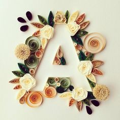 the letters are made out of paper and decorated with different types of flowers on them