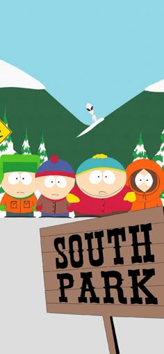 a sign that says south park in front of some cartoon characters with skis on