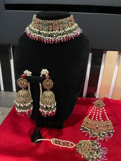 a necklace and earring set on display