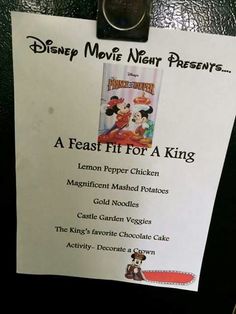 a menu for a disney movie night is posted on the wall in front of a door