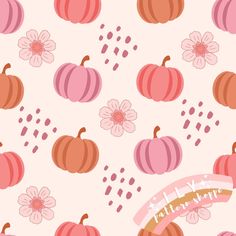 a pink and orange pattern with pumpkins, flowers and dots on it's surface