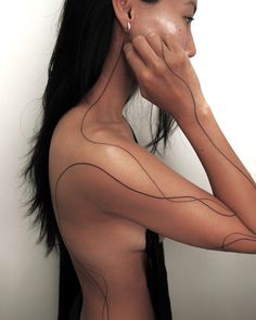 a woman with black lines on her body