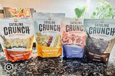 three bags of catalina crunch are sitting on a countertop next to each other