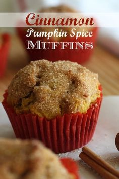 cinnamon pumpkin spice muffins with cinnamon sticks in the foreground and on the background