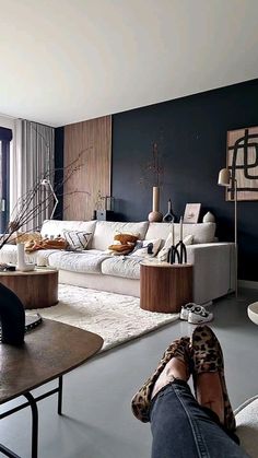 a living room filled with lots of furniture and decor