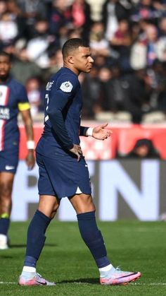 a soccer player is walking on the field