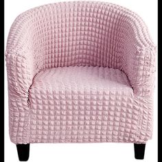 a pink chair sitting on top of a white floor