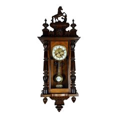 an old wooden clock with roman numerals on the front and sides, mounted against a white background