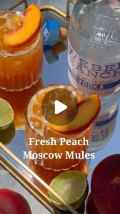 fresh peach moscow mules on a tray with apples