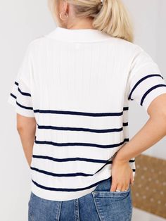 Experience effortless preppy inspired style with this new arrival. The lightweight, textured fabric features a classic stripe pattern and short sleeves for a stylish and comfortable look. Perfect for any occasion, this top will add a touch of sophistication to your wardrobe. Collared detail Stripe pattern Textured fabrications Short sleeves Lightweight 60% Polyester, 40% Viscose Body length measurement: 22" from a S. Bust measurement: 21" from a S. Model is wearing a S. Navy Classic Top With Horizontal Stripes, Classic Navy Tops With Horizontal Stripes, Classic Navy Top With Horizontal Stripes, White Horizontal Stripe Top For Work, Striped Ribbed Short Sleeve Tops, Navy Tops With Contrast Stripes For Spring, Navy Top With Contrast Stripes For Spring, Navy Short Sleeve Top With Contrast Stripes, Navy Short Sleeve Tops With Contrast Stripes