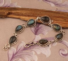 Made by   SHREEJAIPURSILVER925 Designed By  Make Mom's last-minute gift more thoughtful with a gift teaserNEW spring fashion https://shreejaipursilver925.etsy.com Labradorite Bracelet 925 Sterling Silver Bracelet Fire Stone Bracelet Handmade Bracelet For Gift Natural Gemstone Jewelry Birthstone Jewelry #holidaytable #cyberweek #thanksgivingdecor #challenge #Chrismtasgift #Bridesmaid #Anniversary #Birthday #readytogift #Birthstoneitem #ringforwoman #Fastersellingitem #Bestseller #silverartisanwor Artisan Labradorite Bracelets For Gifts, Bohemian Sterling Silver Bracelet With Natural Stones As Gift, Silver Bracelet With Natural Stones Gift, Sterling Silver Teardrop Bracelet As Gift, Labradorite Round Bracelet Gift, Handmade Teardrop Bracelets As Gift, Elegant Labradorite Bracelets For Gifts, Handmade Sterling Silver Healing Bracelet, Artisan Silver Labradorite Bracelet