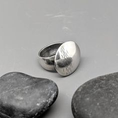 Chunky sterling ring with hand hammered textural pattern. Subtle texture and style, yet big impact in form. Hand formed, domed, and textured from sterling silver sheet. Size 7.  Can easily be sized. Top measures 21mm diameter. (about 0.8 inches across)  Ring shank tapers slightly from about 10mm wide to 8mm wide at bottom. Hollow Form, Subtle Textures, Sterling Ring, Rings Statement, Statement Rings, Jewelry Rings, Texture, Sterling Silver, Ring