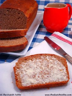 two slices of bread sitting on top of a blue and white checkered table cloth