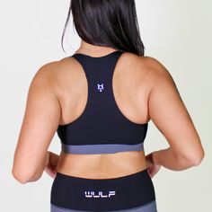 MATERIAL: 63% nylon/37%spandex FIT: ﻿True to size. DESIGN: Sports bra with scoop neckline. Medium support bra. Added zipper in the middle of the chest. Available in purple/black and gray/black. MODEL: Model is 5'5", 120 lbs, wearing a size Medium. WASHING: We recommend washing inside-out on a cold setting. Hang to dry. This sensational sports bra is designed to elevate your workout and give you confidence in the gym. Crafted with a chic scoop neckline, this medium support gym bra embraces your c High Stretch Black Yoga Bra, Black Yoga Bra With Medium Bust Support, Black Stretch Bra With Light Support, Functional Black Training Bra, High Stretch Sports Bra In Black, Black Stretch Gym Bra, Black Training Bra With Light Support, Black High Stretch Scoop Neck Sports Bra, Black Stretch Bra For Gym