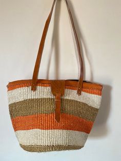 This listing is for size 10 by 10 inches tote sisal basket that has been carefuly handwoven by skilled women in Kenya. it can be used as a beach basket, and a all carry day kinda bag Dimensions Height 10 inches Width 10 inches We ship via DHL which takes 3-5 days To continue shopping click on the link below https://www.etsy.com/shop/TweetieAfrica?ref=seller-platform-mcnav Large Capacity Jute Bucket Bag, Jute Basket Bucket Bag For Shopping, Shopping Handwoven Basket Bucket Bag, Handwoven Basket Bucket Bag For Shopping, Weaved Bucket Bag For Market, Handwoven Brown Basket Beach Bag, Brown Handwoven Basket Beach Bag, Weaving Straw Bucket Bag For Market, Bucket Straw Bag With Weaving For Market