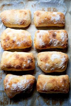 there are many baked goods on the baking sheet with text overlay that reads how to make sourdouy ciabatta