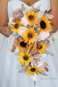 a bride holding a bouquet of sunflowers and roses