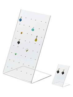 an acrylic display with earrings on it