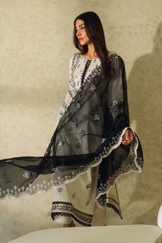 Brand: NeeshayCollection: Neeshay Monochrome Unstitched Summer CollectionFabric: Lawn DESIGN DETAILS: Embroidered Lawn Front 1 Piece Plain Lawn Back 1 Piece Embroidered Lawn Sleeves 0.66 Meter Embroidered Organza Front Border 1 Meter Embroidered Organza Sleeves Border 1 Meter Embroidered Khadi Net Dupatta 2.5 Meter Plain Dyed Cambric Trouser 2.5 Meter DISCLAIMER:* Lining, Laces, and Tassels are not included in unstitched variants.* Embellishment items in stitched outfits are subject to market av Elegant Off White Embroidered Sets, Elegant Off White Sets With Intricate Embroidery, Elegant Off-white Sets With Intricate Embroidery, Elegant Unstitched Suit With Embroidered Border For Festive Season, Festive Elegant Unstitched Suit With Embroidered Border, Elegant Festive Unstitched Suit With Embroidered Border, Elegant Embroidered Off White Anarkali Set, Unstitched Elegant Anarkali Set With Embroidered Border, Elegant Unstitched Anarkali Set With Embroidered Border