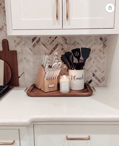 the kitchen counter is clean and ready to be used as a utensil holder