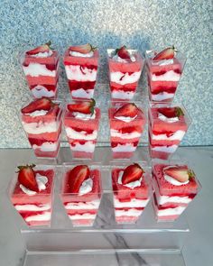 strawberries and ice cream are arranged in small cups