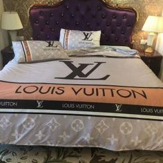 the bed has louis vuitton on it