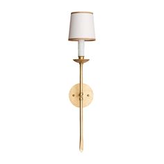 a wall light with a white shade on the side and a gold metal pole attached to it