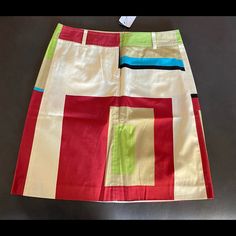 Cute And Colorful Retro Feel Mini. Tan, White, Red, Chartreuse, Black And Aqua In Geometric Patterns. Two Rear Button Pockets With Extra Button. Waist Approximately 14” Wide Length Approximately 19” 100% Cotton. Size 2 Nwt Questions? Please Ask! Offers Welcome Chic Multicolor Cotton Skirt, Grey Academia, Trending Fashion, Retro Color, Mini Fashion, Geometric Patterns, White Skirts, Colorful Fashion, Color Block