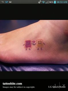 two small tattoos on the foot of a person's feet, one with an elephant and another with a heart