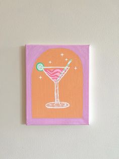 an orange and pink painting hanging on the wall