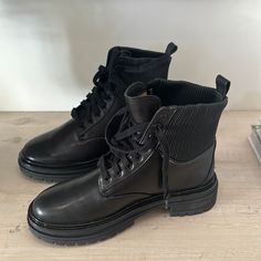 Black Boot. Elegant Black Combat Boots For Fall, Elegant Black High Ankle Combat Boots, Elegant Black Lace-up Combat Boots, Elegant Black Combat Boots With Round Toe, Black Ankle-high Lace-up Work Boots, Black High Ankle Lace-up Boots For Work, Chic Ankle Combat Boots For Work, Chic Black Lace-up Boots For Spring, Black Ankle Combat Boots For Workwear