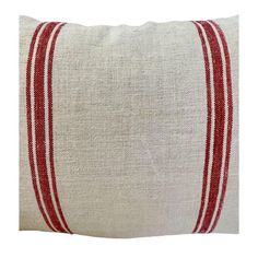 a red and white striped pillow on a white background