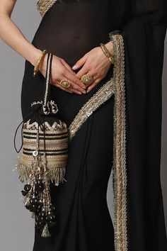 Shop for Shikhar Sharma Black Georgette Embroidered Border Saree With Blouse for Women Online at Aza Fashions Elegant Pre-draped Saree With Tassels For Wedding, Elegant Pre-draped Wedding Saree With Tassels, Elegant Wedding Pre-draped Saree With Tassels, Traditional Wear For Navratri Evening, Traditional Evening Wear For Navratri, Elegant Wedding Saree With Tassels, Embroidered Saree For Navratri Evening, Elegant Saree With Latkans For Festive Occasions, Elegant Saree With Tassels For Reception