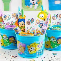 the little mermaid birthday party supplies are in buckets