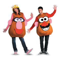 two people in costumes are standing next to each other and one is wearing a costume