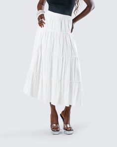 You’ll always be top tier in this white tiered maxi skirt 👑 Made from viscose challis fabric and featuring an elastic waistband and A-line design - this piece is the perfect closet staple to pair with everything 🤍 Spring Relaxed Fit Tiered Maxi Dress, Spring Tiered Maxi Dress With Gathered Skirt, Chic Tiered Maxi Skirt With Layered Hem, Tiered Beach Maxi Skirt, Beach Tiered Maxi Skirt, Flowy Ruffled Midi Maxi Skirt, Chic Tiered Voluminous Maxi Skirt, Chic Voluminous Tiered Maxi Skirt, Relaxed Tiered Maxi Skirt With Layered Hem