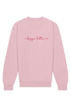 a pink sweatshirt with the words happy little written on it in red and black ink