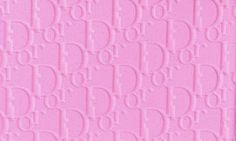 a close up view of a pink wallpaper with the word'd'on it