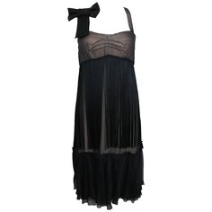 - D&G by Dolce & Gabbana black sheer silk cocktail dress. - Featuring a black bow ribbon on the right spaghetti strap. Flesh coloured silk underlining and black sheer silk layered on top with fringe. Silver zipper at the back fastening. - Made in Tunisia. - Size 38. - 90% Silk, 10% Acetate. Teen Vampire, Collage Pics, Dress Ribbon, Double Layer Dress, Taylor Songs, Fantasy Wardrobe, Alternate Universe, Ribbon Dress, Silk Cocktail Dress