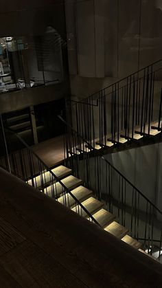 the stairs are lit up at night with light coming from them and shining down on the floor