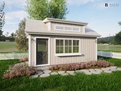 a small house with a white picket fence and flowers in the front yard, next to a garden