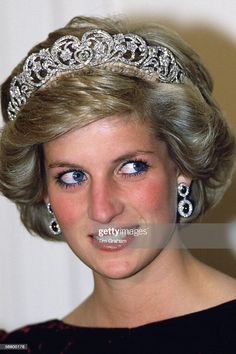 the princess of wales wearing a tiara and earrings