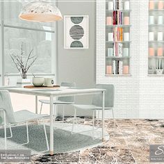 a white table and chairs in front of a window with bookshelves on the wall