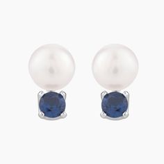 Elevate your jewelry collection with the timeless sophistication of our Sterling Silver Fresh Water Pearl and Blue Spinel Stud Earrings. Each earring showcases a lustrous, round fresh water pearl gracefully accented by a radiant blue spinel stone. The harmonious pairing of these two captivating gems, set in sterling silver, creates an irresistible allure that transcends fleeting trends. These versatile earrings effortlessly transition from day to night, adding a touch of refined elegance to any ensemble. Blue Pearl Earrings Fine Jewelry For Formal Events, Blue Pearl Earrings For Formal Occasions, Blue Pearl Earrings For Formal Events, Blue Pearl Earrings For Anniversary Fine Jewelry, Blue Pearl Earrings For Anniversary, Fine Jewelry Blue Pearl Drop Earrings, Blue Pearl Drop Earrings Fine Jewelry, Classic Blue Pearl Drop Earrings, Blue Round Pearl Earrings For Anniversary