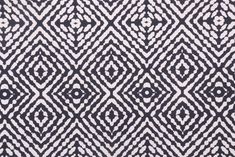 an abstract black and white pattern on fabric